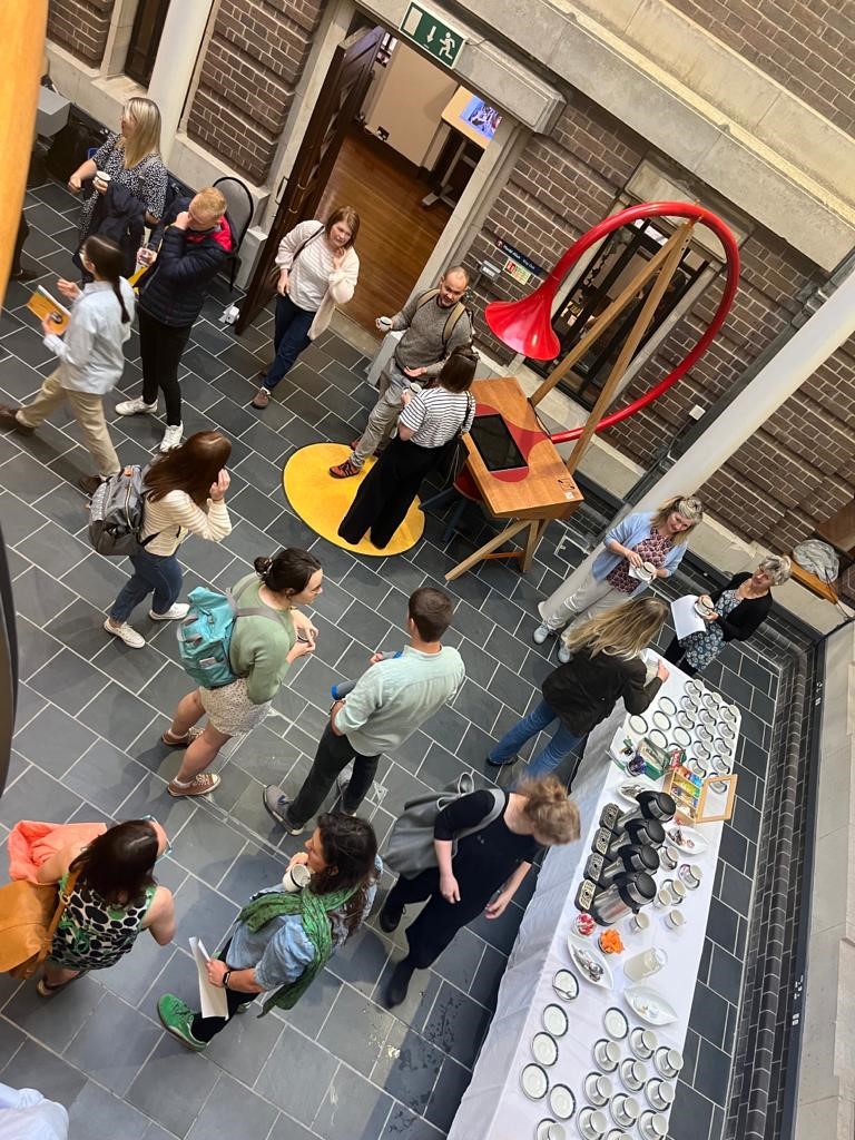 Post-graduate students socialising at the Research Conference 2023